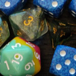 green and blue tabletop RPG dice