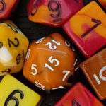 orange and red tabletop RPG dice - TTRPGkids
