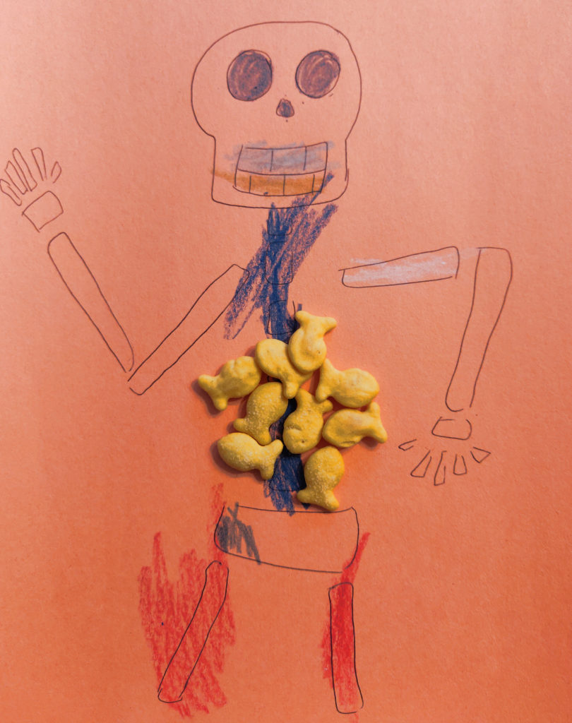 DIY point tracker for games with kids - health tracker on skeleton picture with snacks as health