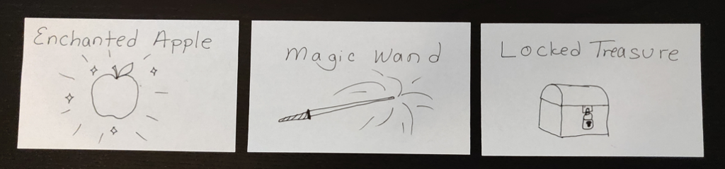 notecards showing magic wand, locked treasure, and an enchanted apple
