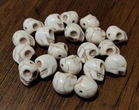 Dissent tokens from the game, all of which are little skulls