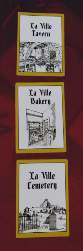 photos of three of the location cards for monumental consequences:
La Ville Tavern
La Ville Bakery
La Ville Cemetery