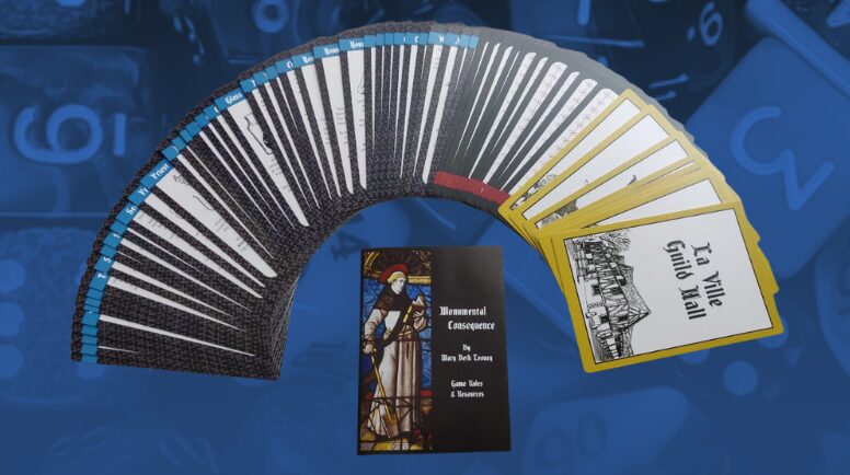 a fan out of all the cards in the deck surrounding a small booklet of rules for Monumental Consequences