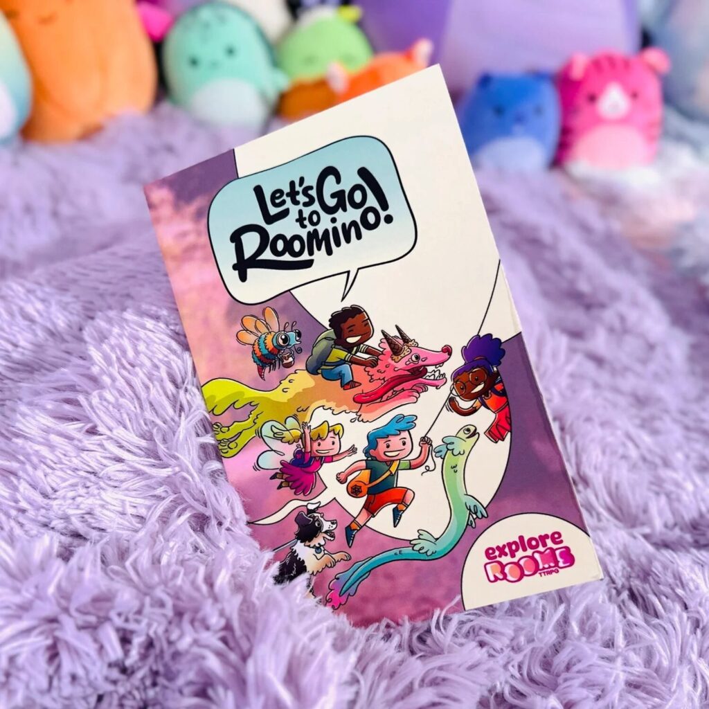 photo of Let's Go to Roomino nestled amongst a plush purple blanket