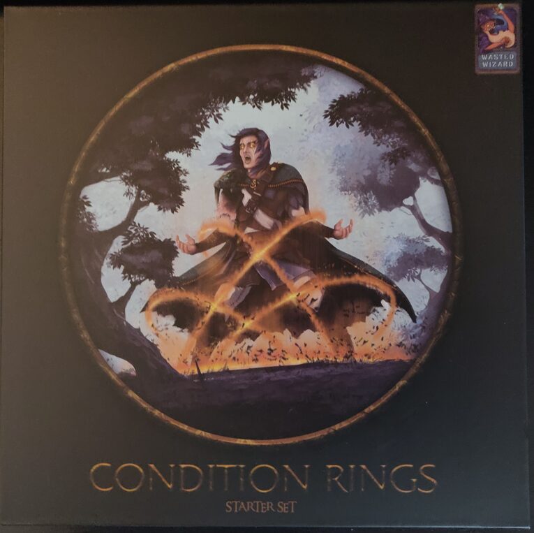 photo of the front cover of the box showing a character in dark robes being held down by a spell