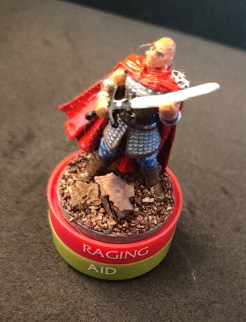 a Minsc mini sitting on rings labeled "Raging" and "Aid"