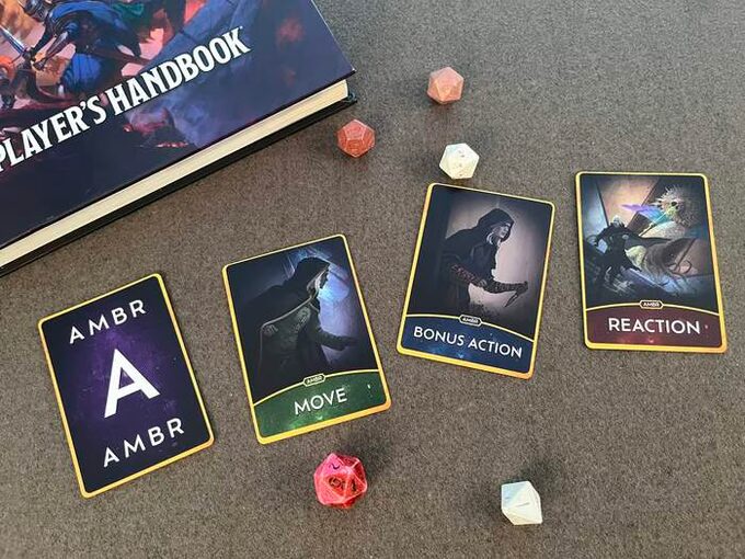 photograph of the AMBR cards with the A flipped over (showing used) and the move, bonus action, and reaction cards still showing available.