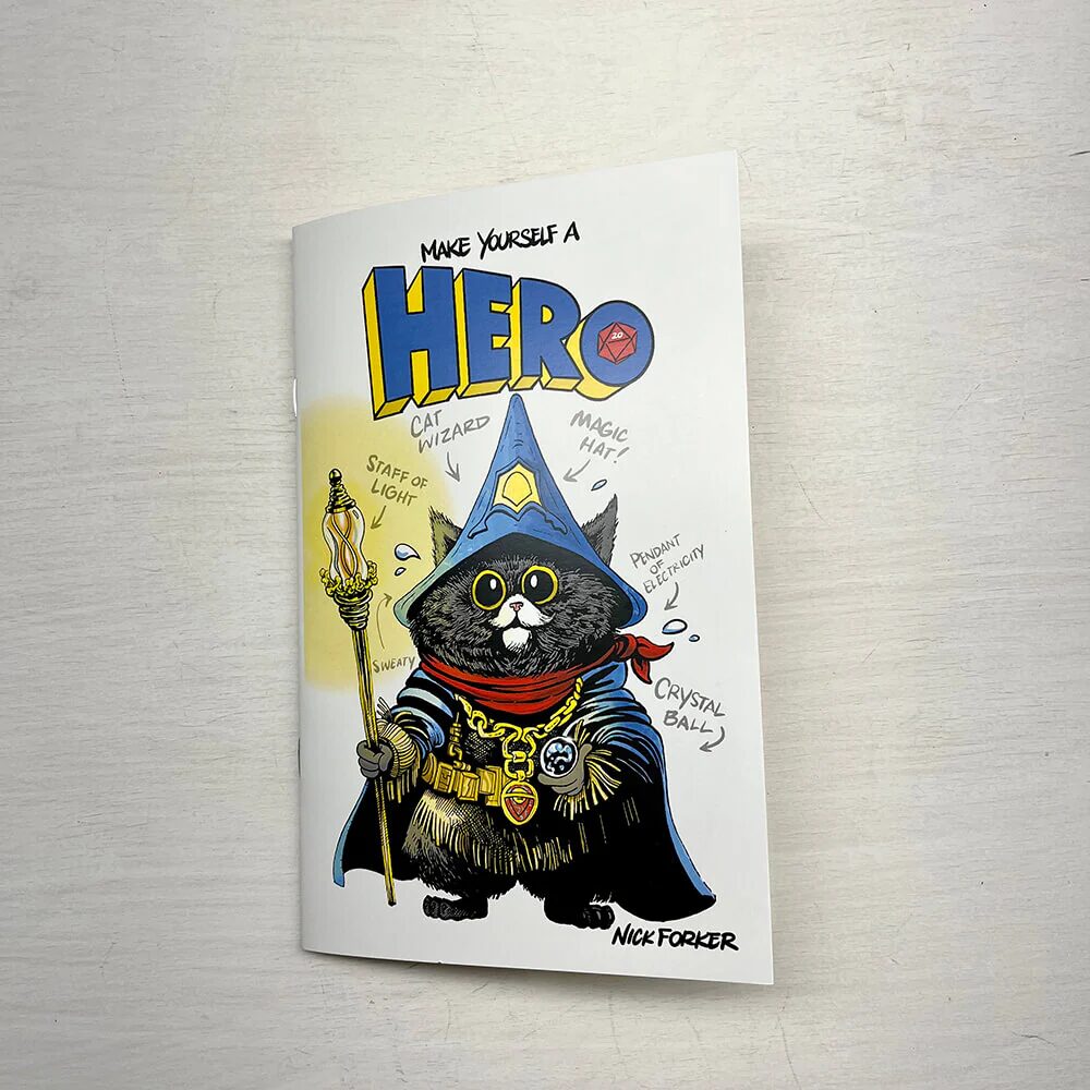 A photo of the cover of Make Yourself a Hero featuring an illustratin of a cat wizard