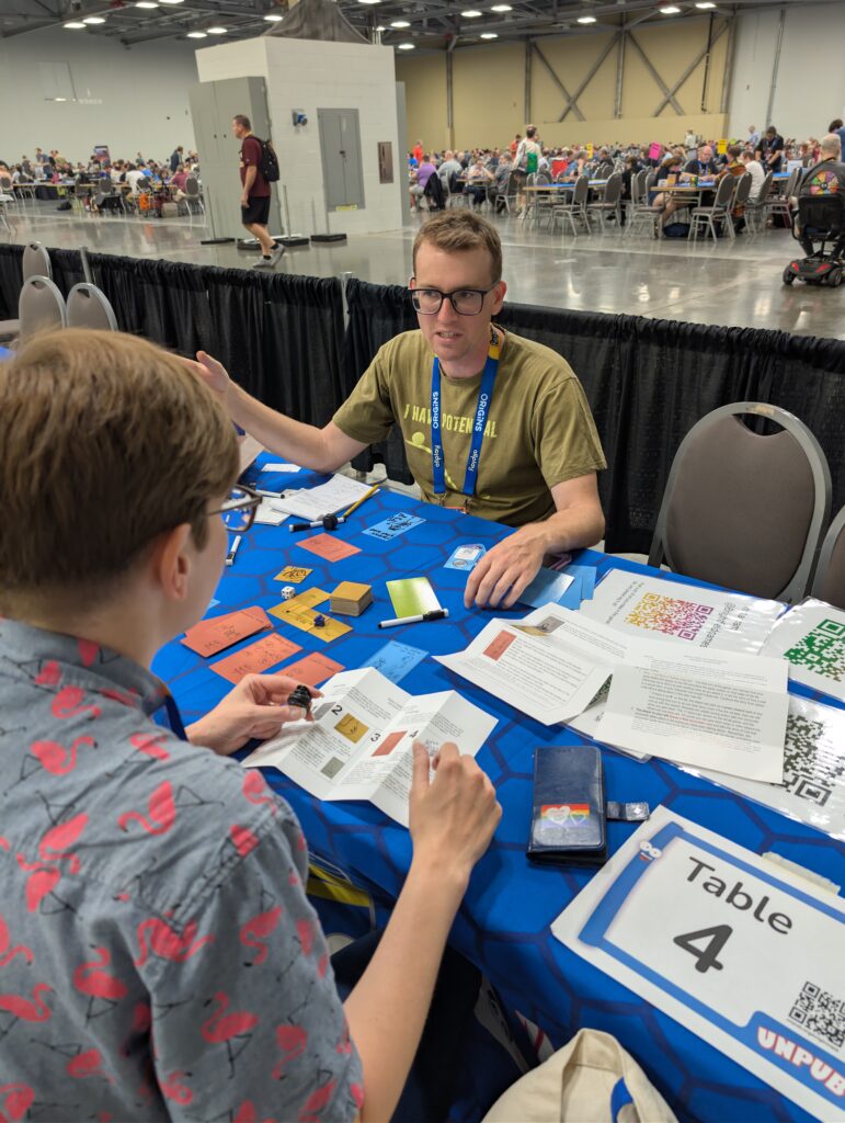 a photo of Andy Charlton showing Steph Campbell a new game