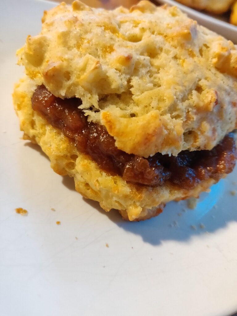 a photo of a buscuit filled with apple butter