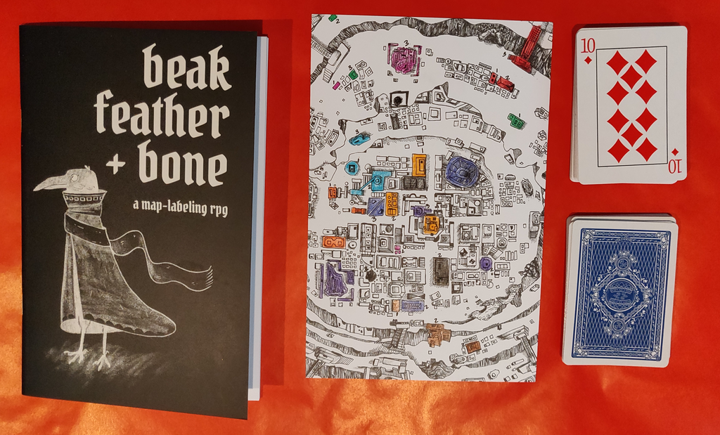 Photo showing the Beak, Feather, & Bone book and my map and card deck used for one of my playthroughs
